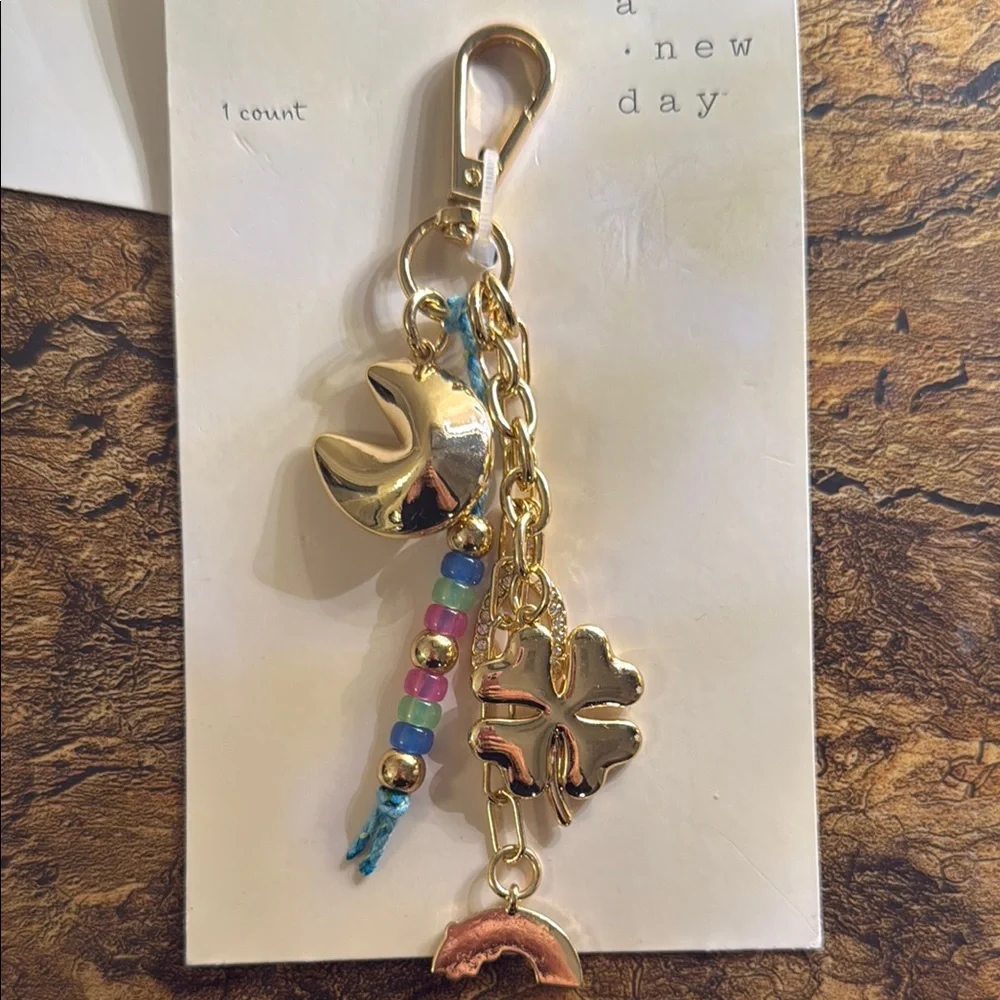 A New Day Gold keychains /  bag charms pick one